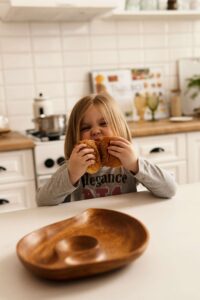Child happily eating safe food at home with support from nutrition therapy Raleigh, NC and nutritional therapist Raleigh, NC for ARFID treatment without pressure or shame